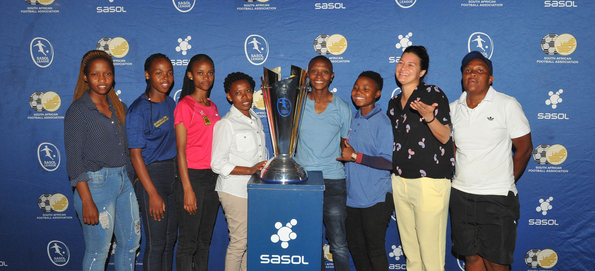 Sasol league team captains with the championship trophy