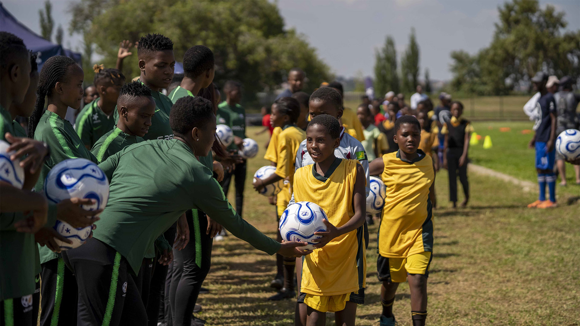 Banyana Banyana players handover balls to girls for limitless