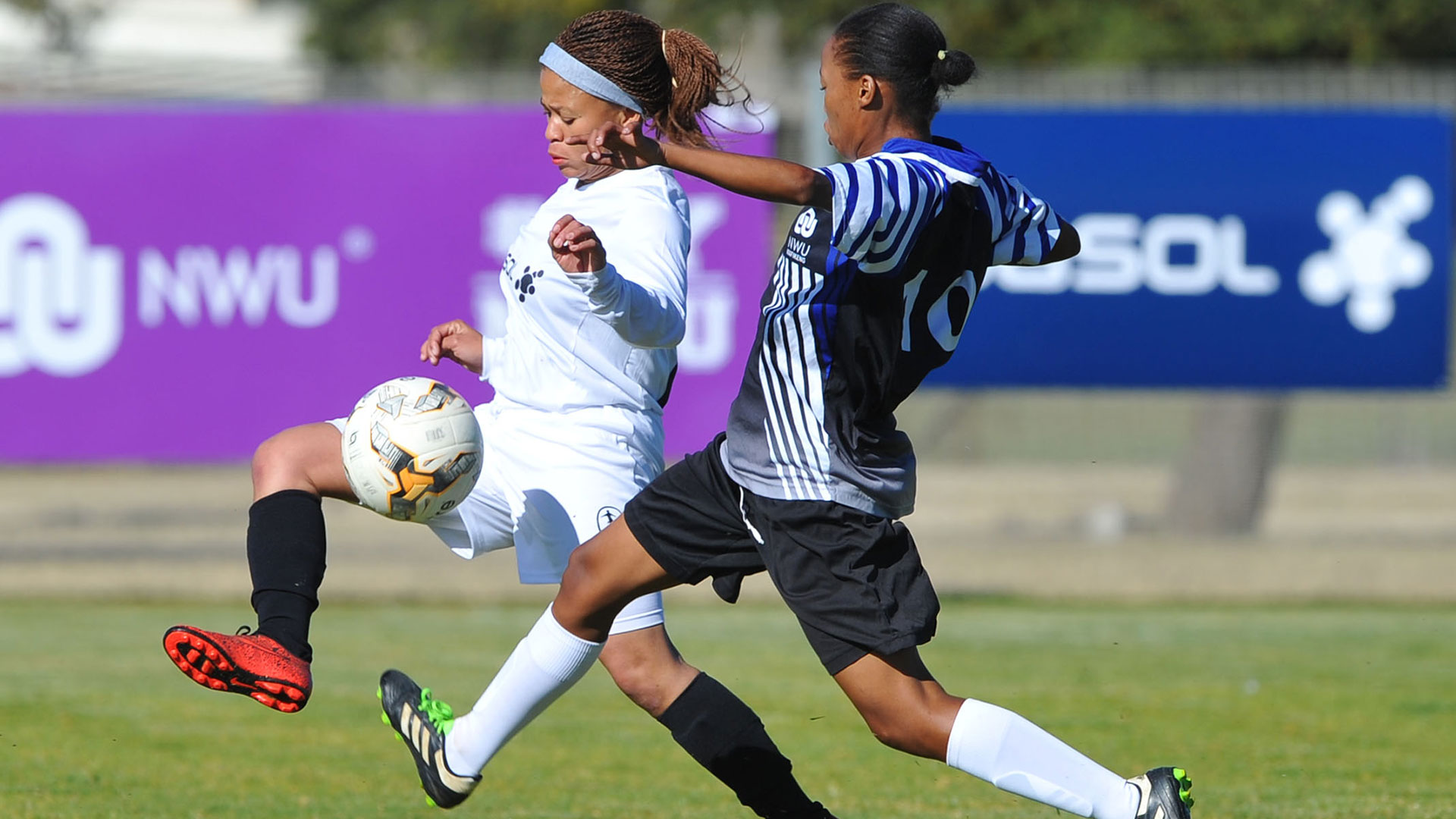 Sasol League players fighting for the ball